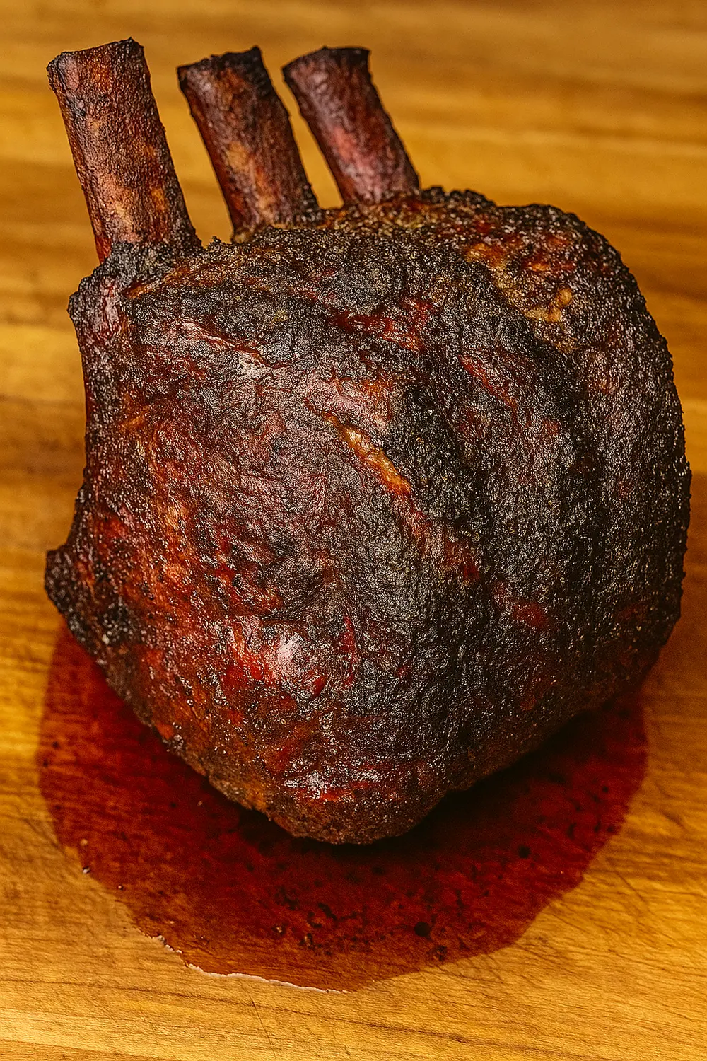Smoked prime rib roast with a beautiful smoky bark and juicy medium-rare center, a mouthwatering main course ideal for festive holiday celebrations.