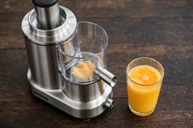 High speed centrifugal juicer with orange juice glass