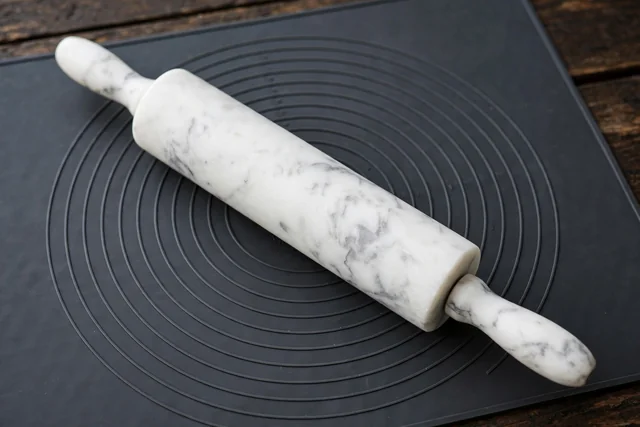 Marble rolling pin on a silicone pastry mat